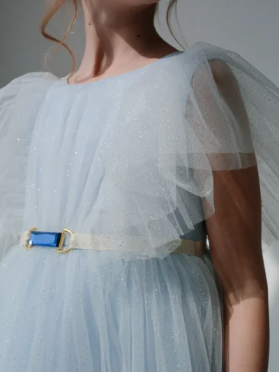 Gathered dress for a girl with tulle frills, glitter and crystal on the belt